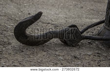 Gray, Iron, Hook Lying On The Asphalt