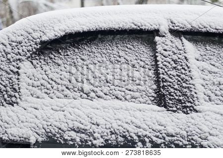 Side Windows Of A Car In The Snow Close Up