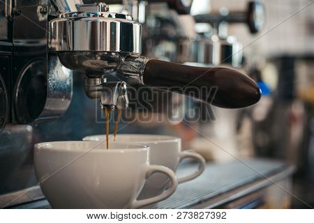 Enjoy Superior Coffee. Making Espresso With Portafilter. Small Cups To Serve Hot Drink. Coffee Being
