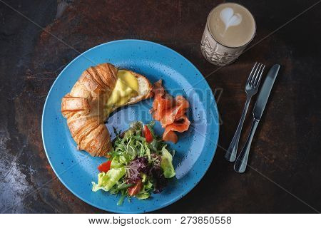 Croissant With Salmon And Cheese With Cup Coffee