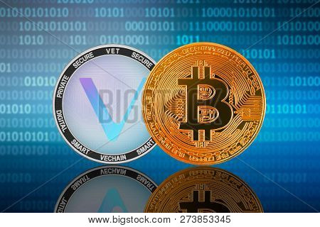 Bitcoin (btc) And Vechain (vet) Coin On The Binary Code Background; Bitcoin Vs Vechain