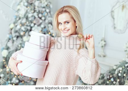 Woman With Gifts In Her Hands, She Shows A Bitcoin Coin.