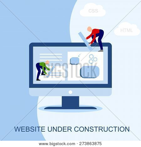 Website Under Construction. Two Of Young Professionals Working On A Web Page. Web Development.