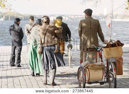 Stockholm - Sept 22, 2018: Rear View Of People  Wearing Old Fashioned Tweed Clothes From The 1950s L