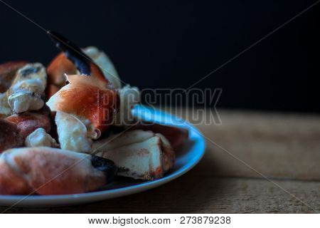 Crab Claws From Atlantic Coast On A Plate In The Black Background