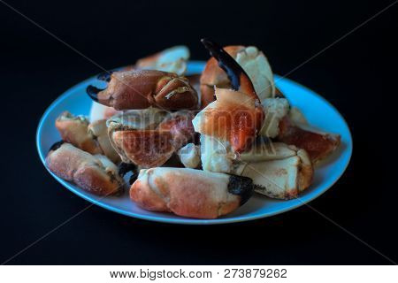 Crab Claws From Atlantic Coast On A Plate In The Black Background