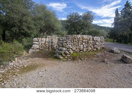 Remains Of An Old Lime Kiln Oven Structure Built In Stone On A Sunny Day In December In Lluc, Mallor