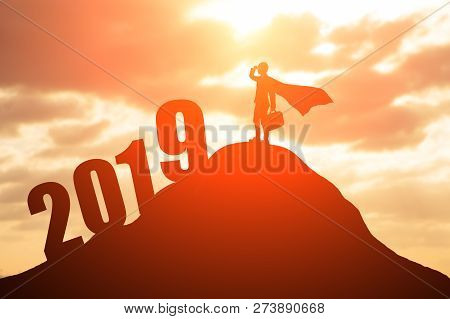 Silhouette Of Super Business Man Look Somewhere With 2019 On The Mountain
