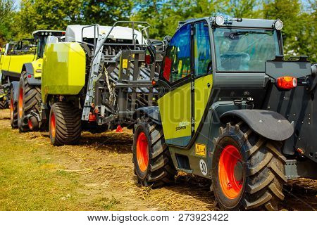 Vinnitsa, Ukraine - July 2017: Grain Harvesting Equipment In The Field. Agricultural Sector