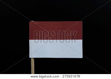 A Official Flag Of Indonesia On Black Background On Wooden Toothpick. A Horizontal Bicolour Of Red A
