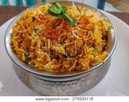 Dum Biryani Served In A Steel Pot