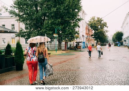 Mogilev, Belarus - August 18, 2018: People Walking On Old Street In Summer Rainy Day.