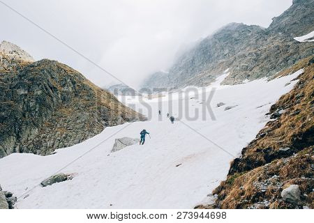 A Group Of Mountaineers Climbs To The Top Of The Rysy Peak, Tatra Mountains