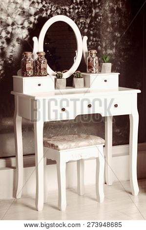 White Beauty Vintage Pier Glass With An Oval Mirror With A Chair Indoors
