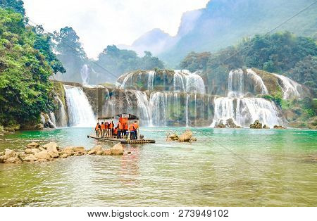Cao Bang, Vietnam - Nov 30, 2018 : Tourist Visiting Ban Gioc Waterfall Or Detian Falls By Bamboo Boa
