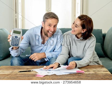 Happy Young Couple Feeling Proud Of Home Finance