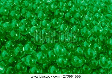 Water Green Gel Balls With Bokeh. Polymer Gel. Silica Gel. Balls Of Green Hydrogel. Crystal Liquid B