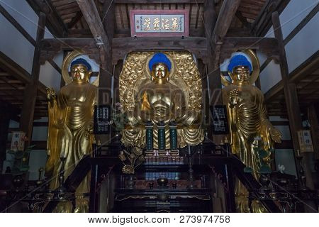 Fukuoka, Japan- October18, 2018: Golden buddha statues in the historical Shofokuji temple, the first zen temple in Japan 