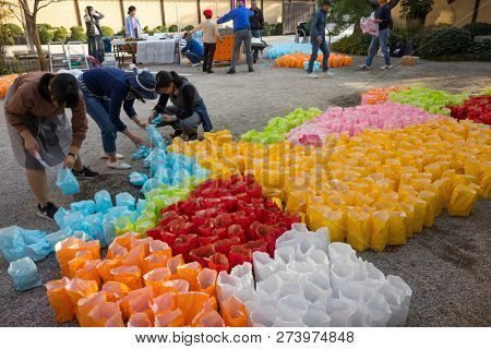 Fukuoka, Japan - October 20, 2018: Preparing colorful paper lanterns for the Hakata Tomyo Watching festival at the  Shofukuji temple grounds 