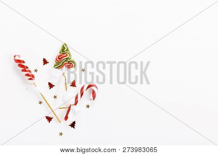 Christmas Composition. Xmas Pink Decor, Christmas Candy Cane With Ribbon On White Background.