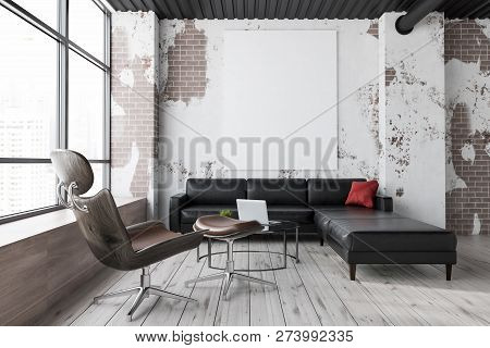 Grunge Living Room Interior With Brick Walls, Wooden Floor, Large Window, Big Black Leather Sofa And