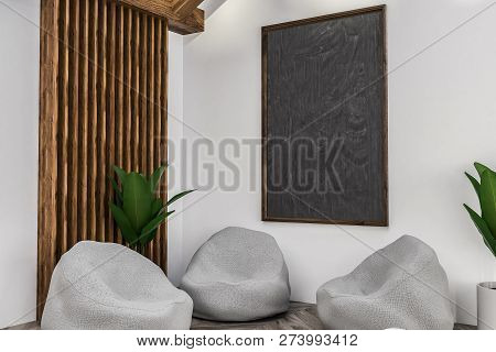 Corner Of Modern Cafe With White And Wooden Walls, Wooden Floor, Three Gray Armchairs Standing Under