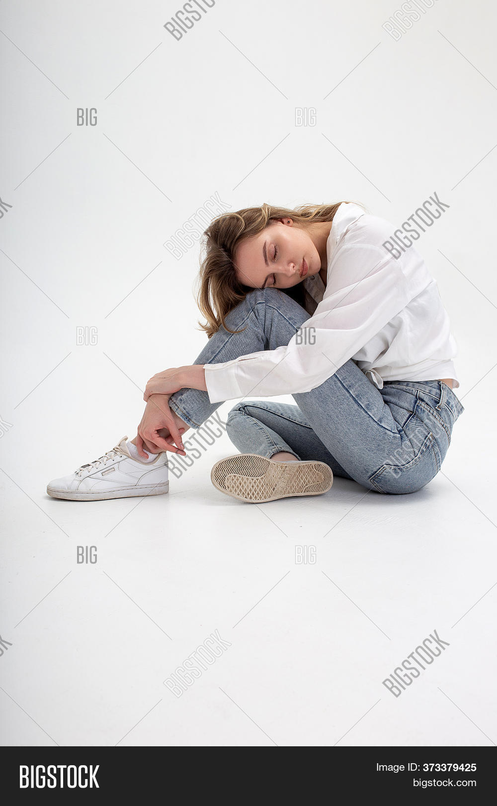 beautiful girl sitting on the floor in different poses Stock Photo | Adobe  Stock