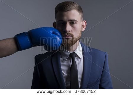 Close-up Portrait Of A Young Bearded Guy In A Business Suit, Businessman, Side View The Hand Of An O