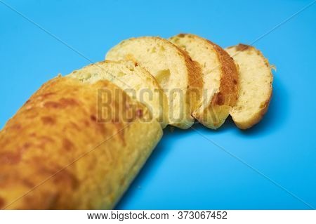 Sliced Ciabatta On A Blue Background.