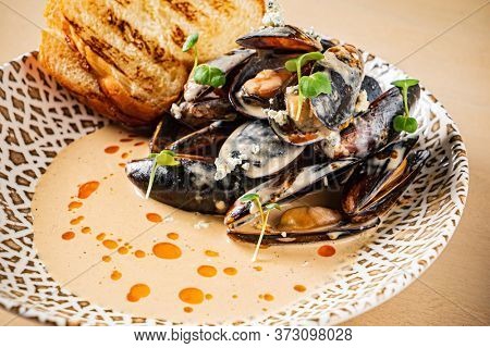 Plate of mussels with creme dubarry in restaurant