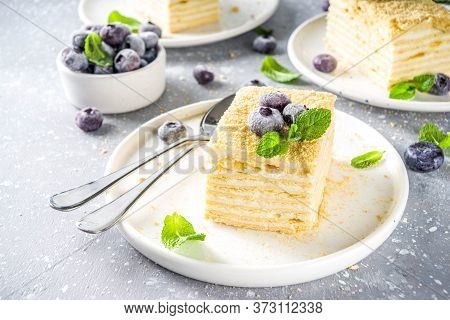 Homemade Baked Cake Napoleon, Millefeuille. Delicate Custard Cake Garnished With Berries And Mint. O