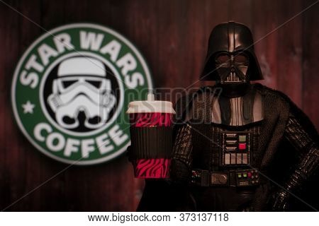 JUNE 21 2020: Humorous image of Star Wars Darth Vader with a coffee drink and a Star Wars Coffee sign - Hasbro action figure