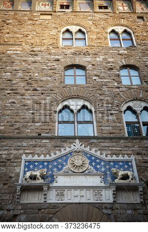 Florence, Italy - October 2019: The Frontispiece Decorated At The Entrance Of Palazzo Vecchio, The T