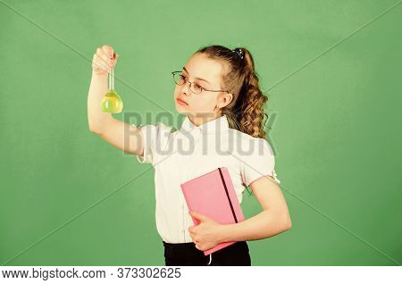 Back To School. Small Smart Girl With Testing Flask. Education And Knowledge. Child Study Bilogy Les