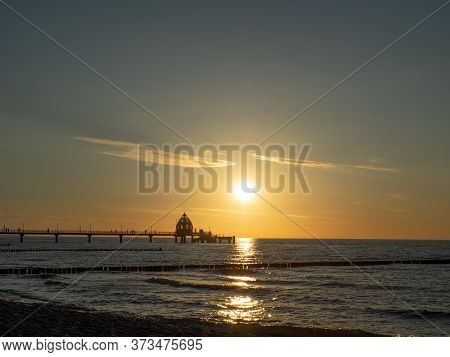 sundown at the beach of zingst at the baltic sea