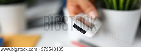 Close-up Of Hand Holding Remote Control From Air Conditioner. System For Controlling Humidity, Venti