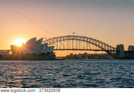 Sydney, Australia - May 27, 2016: Iconic Sydney Opera House And Sydney Harbour Bridge On Sunset