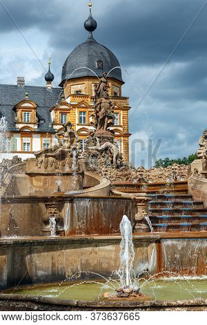 Seehof Palace And Park, Fountain On The Background Of The Castle, Bavaria, Germany.