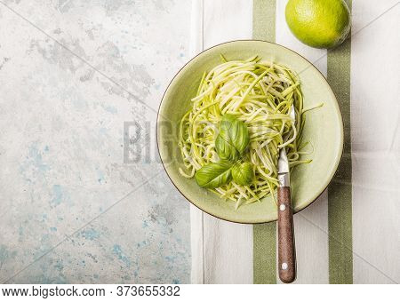 Zucchini Vegetable Noodles - Green Zoodles Or Courgette Spaghetti On Plate Over Gray Background. Cle