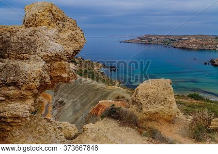 Malta Landscape. View On Orange Rokcs, Juicy Blue Sea And Sky. Beautiful Colorful Coast.