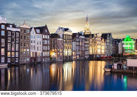 Amsterdam Architecture At Damrak Canal At Night, Netherlands