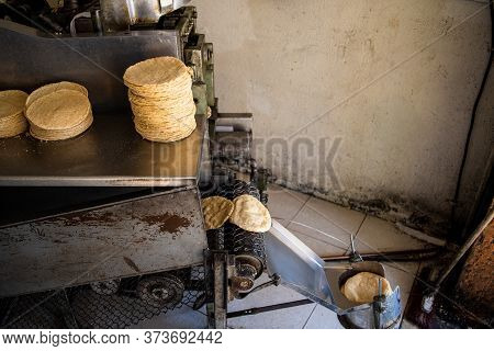 Tortillas Stacked On A Tortilla Machine