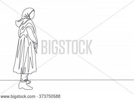 Single Continuous Line Drawing Of Young Beautiful Muslimah With Headscarf Standing On City Street. B