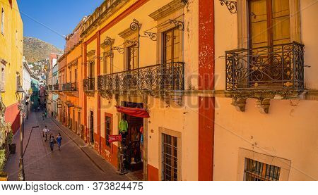 Guanajuato, Guanajuato, Mexico - November 25, 2019:  Tourist Exploring Del Truco Street In Downtown