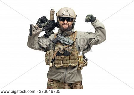 Usa Soldier In A Military Suit With A Rifle Smiles And Shows Strength On A White Background, America