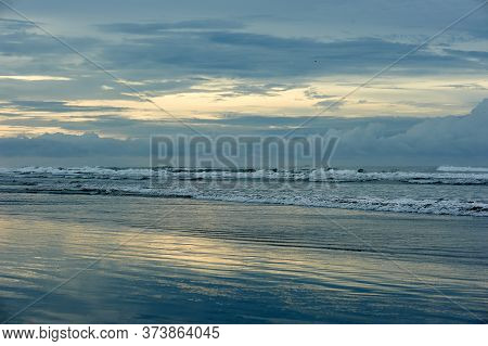 Playa El Cuco Is A Quintessential El Salvador Beach Town. Its Dark Sands Are Lined With Vendor Huts 