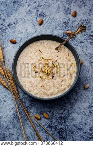 Daliya Kheer or Meetha Dalia Is A Delicious And Healthy Indian Dessert Made With Broken Or Cracked W