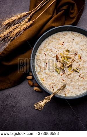 Daliya Kheer or Meetha Dalia Is A Delicious And Healthy Indian Dessert Made With Broken Or Cracked W