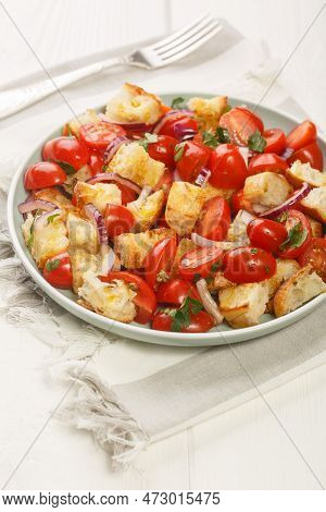 Acquasala Italian Puglian Bread Salad With Cherry Tomato Closeup On The Plate On The Table. Vertical