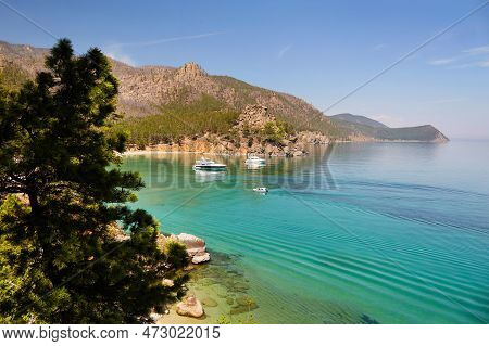 Picturesque Seascape. Yacht In A Bay With Turquoise Water Color. Coniferous Forest. Recreation In Th